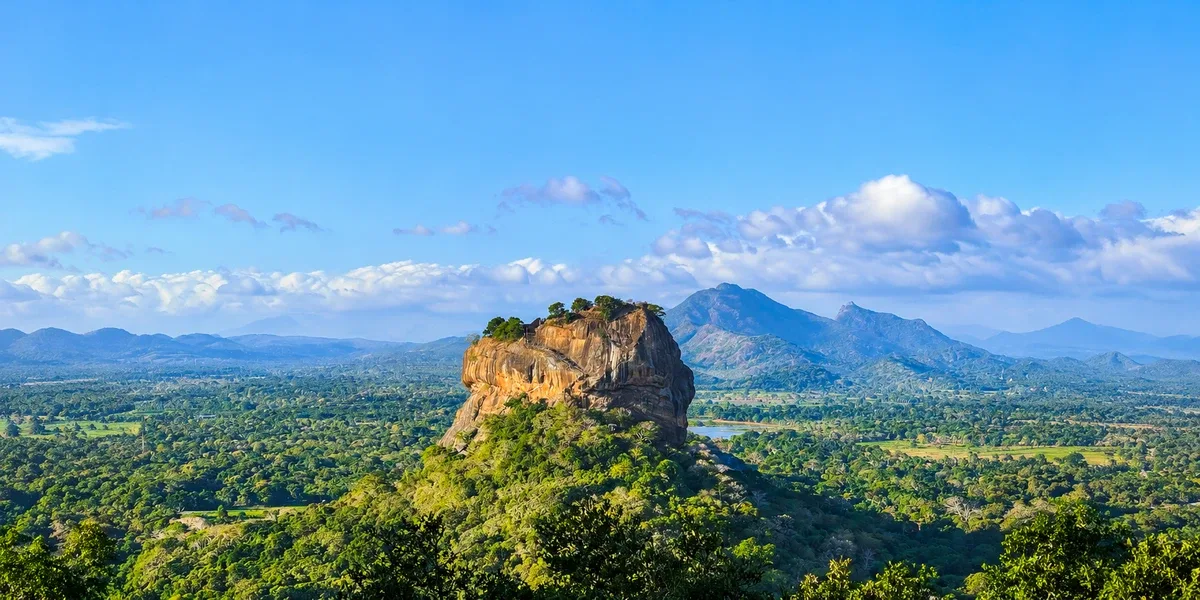 Ancient Sigiriya rock fortress above a green landscape